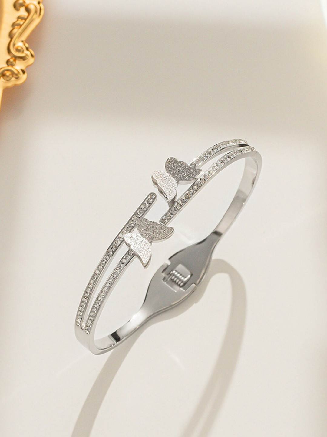 

Jewels Galaxy Silver Plated American Diamond Bangle-Style Bracelet