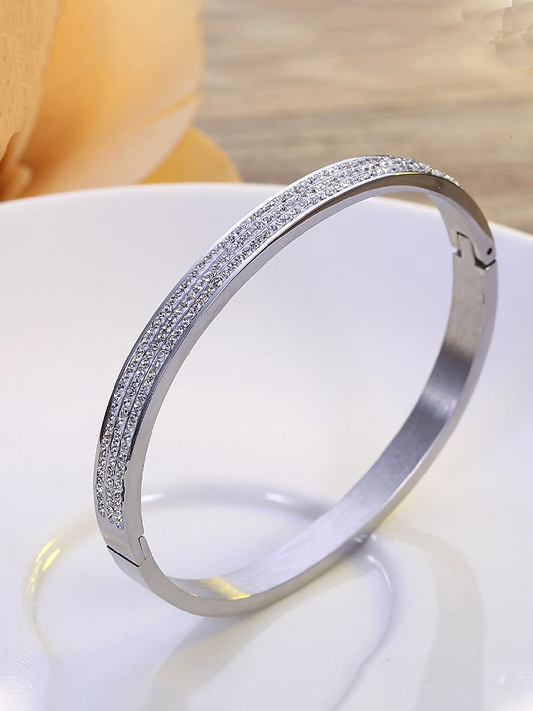 

Jewels Galaxy Silver Plated American Diamond Bangle-Style Bracelet