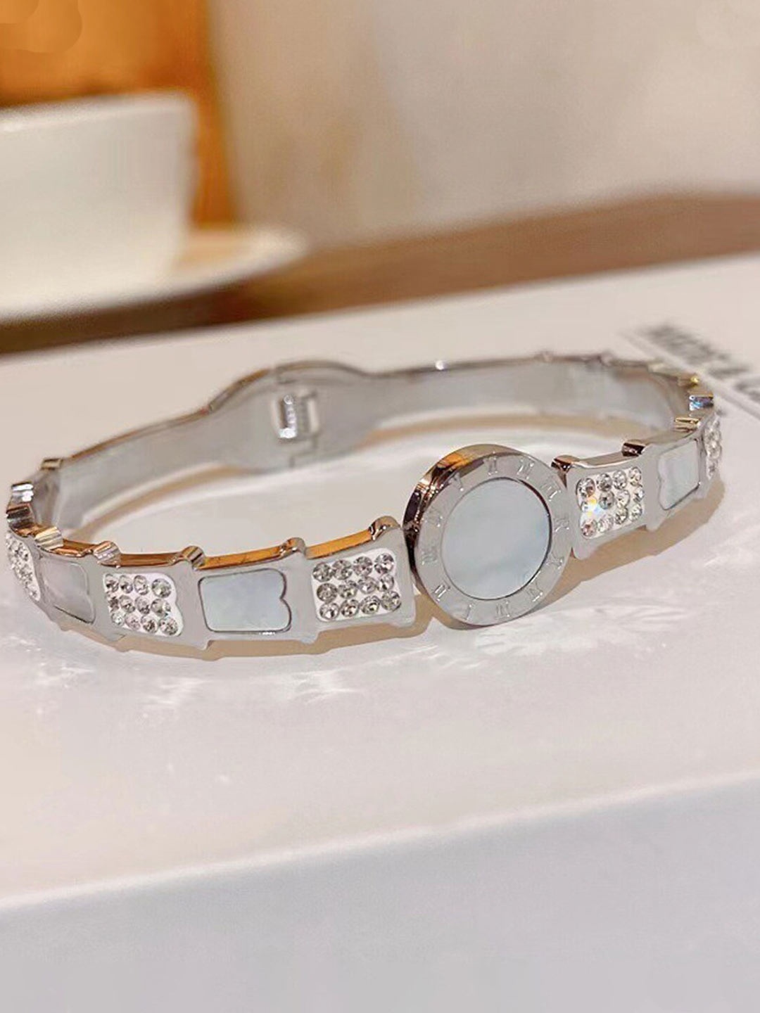 

Jewels Galaxy Silver Plated Stainless Steel Mother of Pearl Bangle Style Bracelet