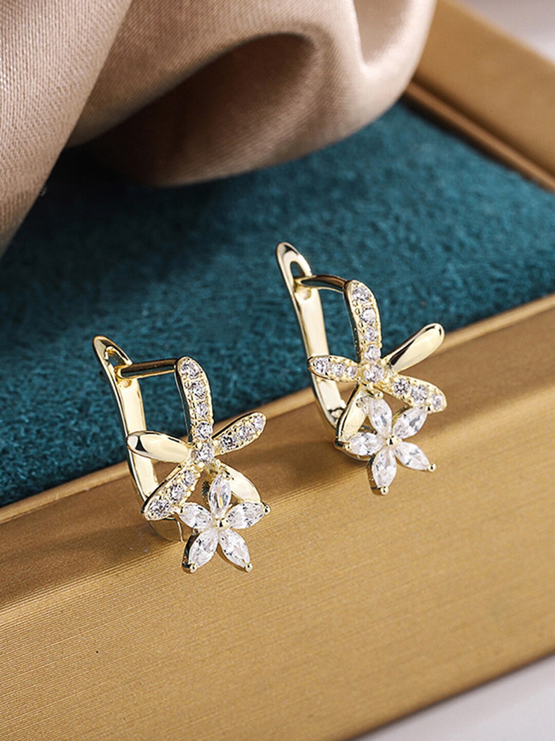 

Jewels Galaxy Gold-Plated American Diamond Studded Star Shaped Drop Earrings