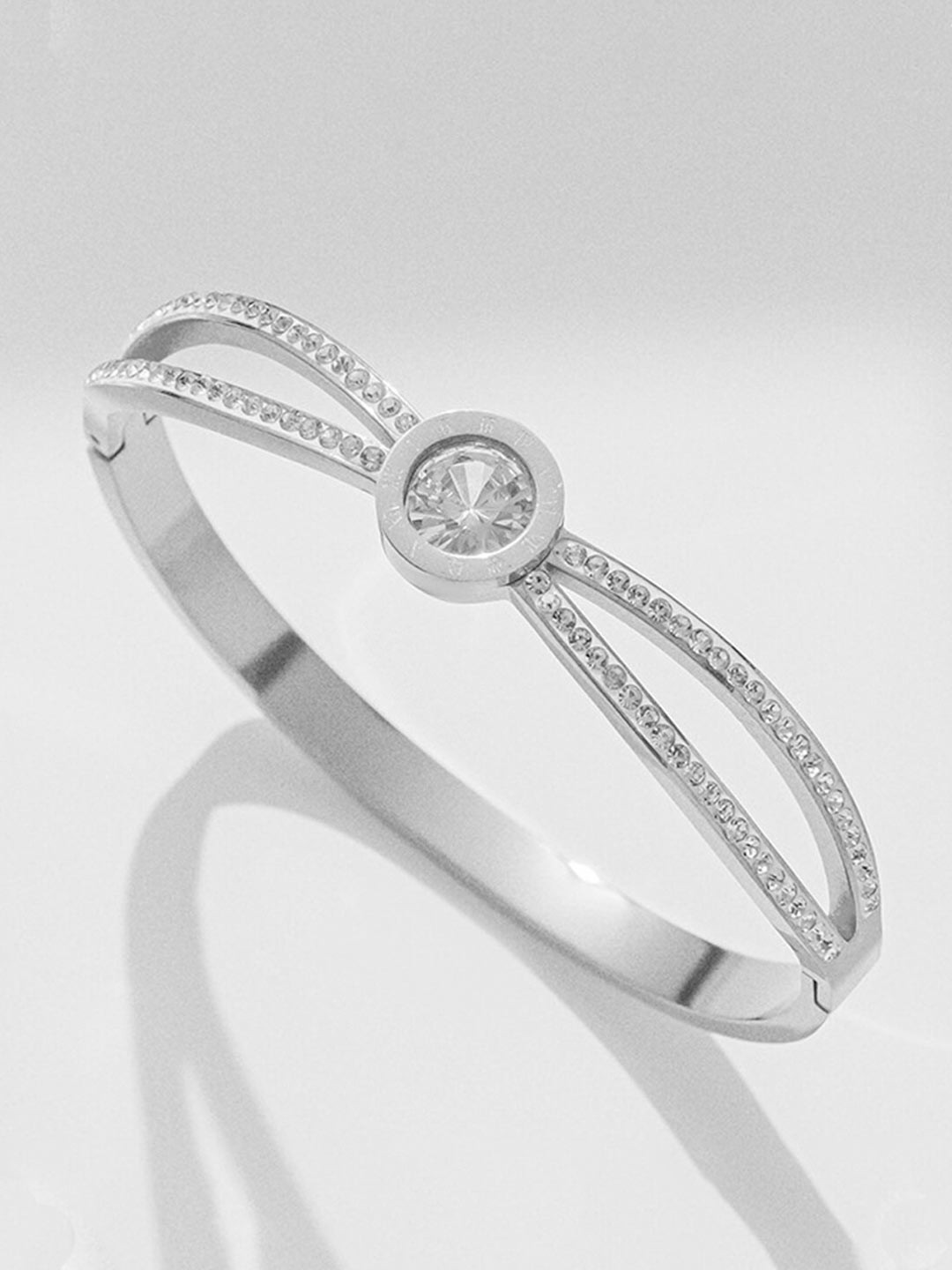 

Jewels Galaxy Silver Plated Stainless Steel American Diamond Bangle Style Bracelet