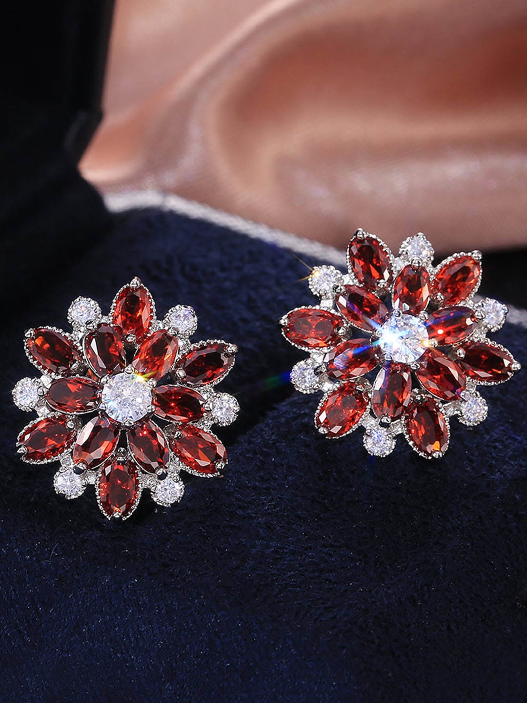 

Jewels Galaxy Silver-Plated American Diamond Studded Floral Studs Earrings, Red