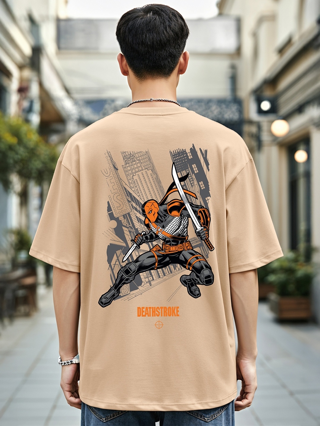 

Bewakoof Deathstroke Printed Drop-Shoulder Sleeves Oversized Cotton T-shirt, Brown