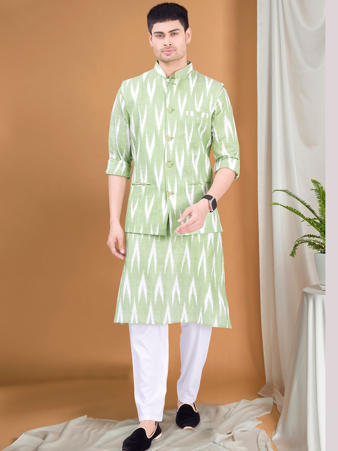

SHIWAM ETHNIX Geometric Ikat Printed Band Collar Straight Kurta & Pyjama With Nehru Jacket, Green