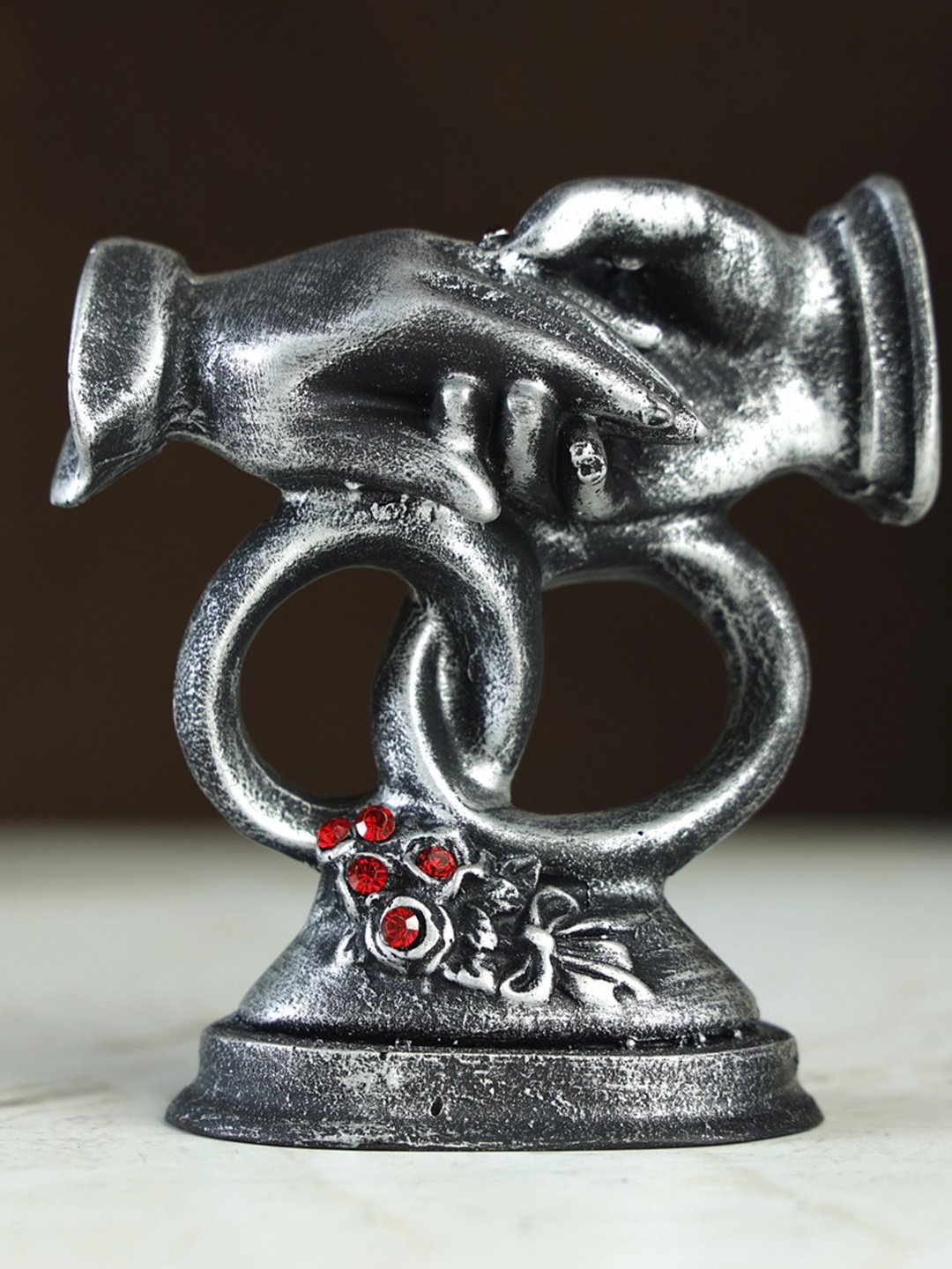 

Goldiluxe Grey & Red Couple Rings Figurine Showpiece