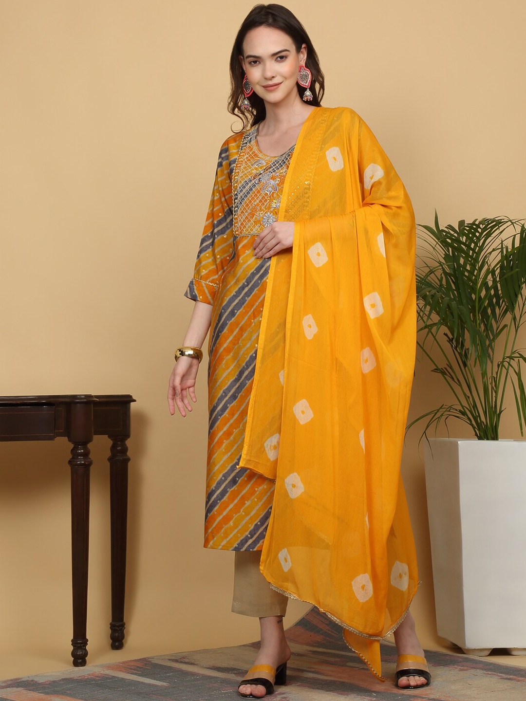 

KALINI Leheriya Printed Sequinned Straight Kurta With Trousers & Dupatta, Yellow