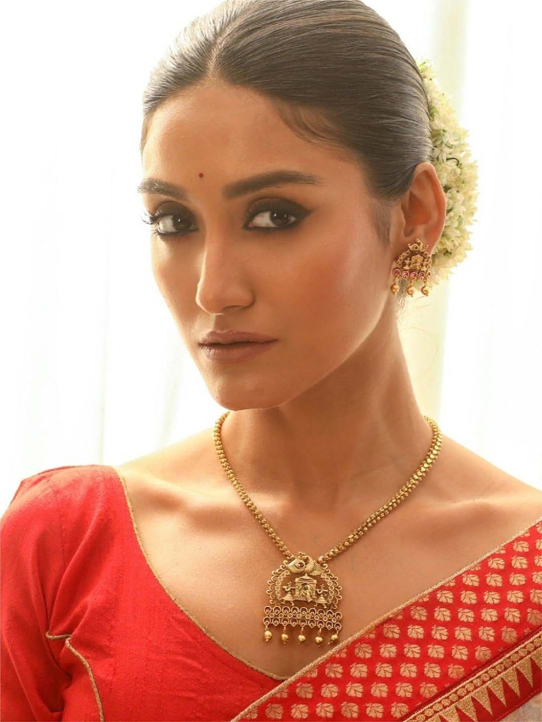 

Tarinika Gold-Plated CZ-Studded Necklace and Earrings Jewellery Set