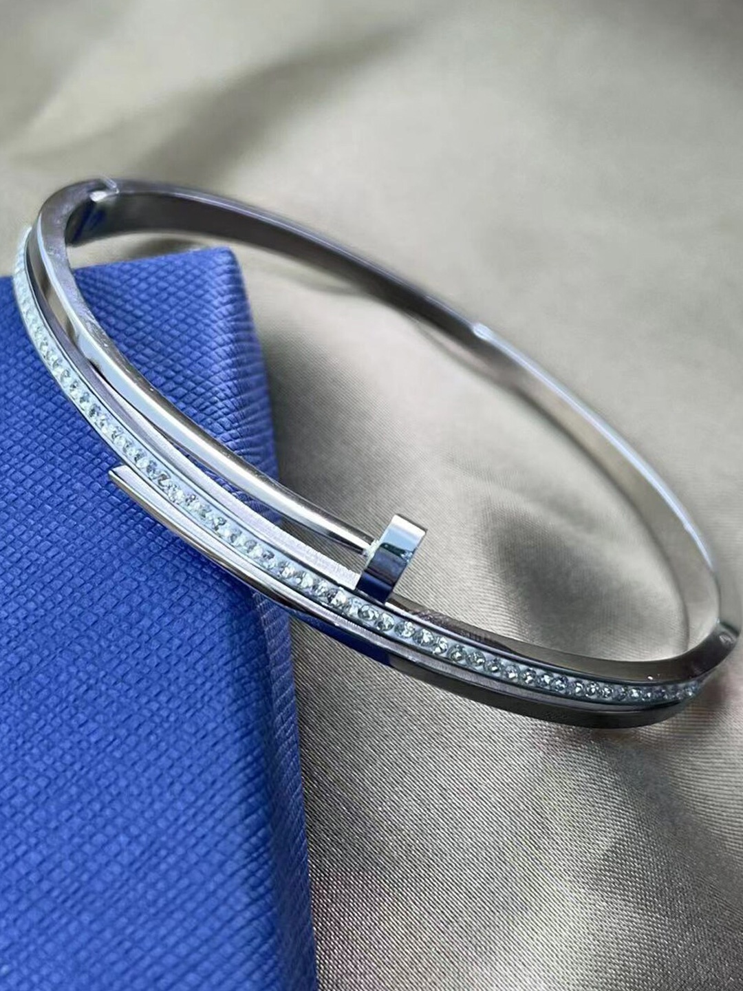 

Designs & You Women Silver-Plated Stainless Steel American Diamond Bangle-Style Bracelet