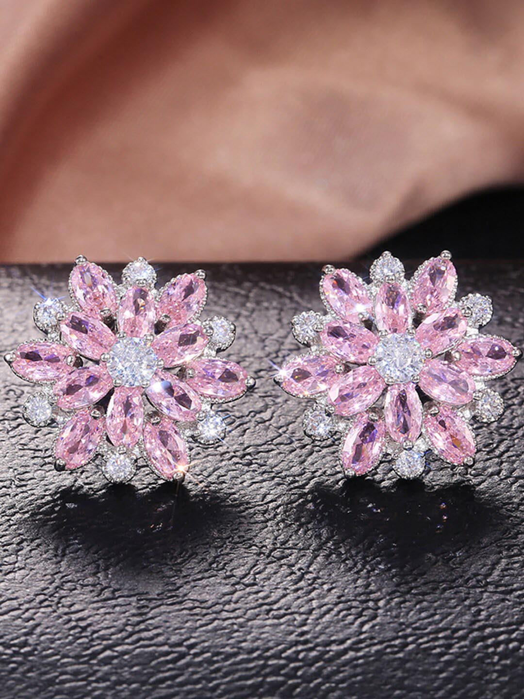 

Designs & You Silver Plated American Diamond Studded Floral Studs Earrings