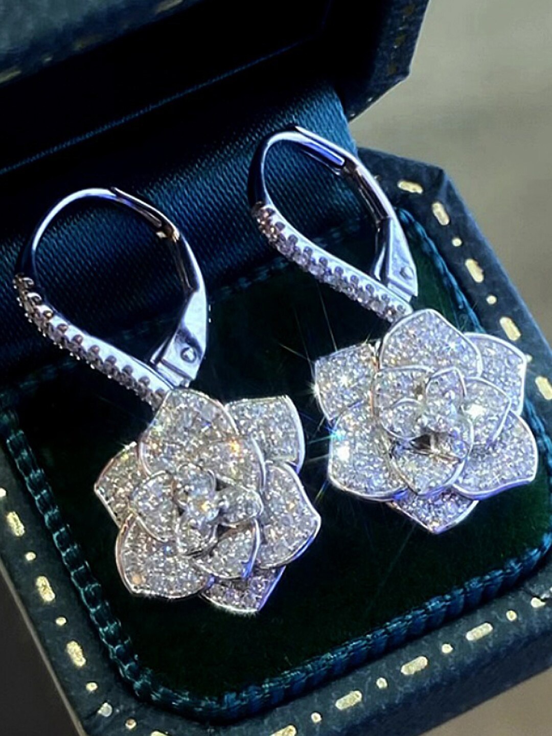 

Designs & You Silver-Plated Floral American Diamond Studded Drop Earrings