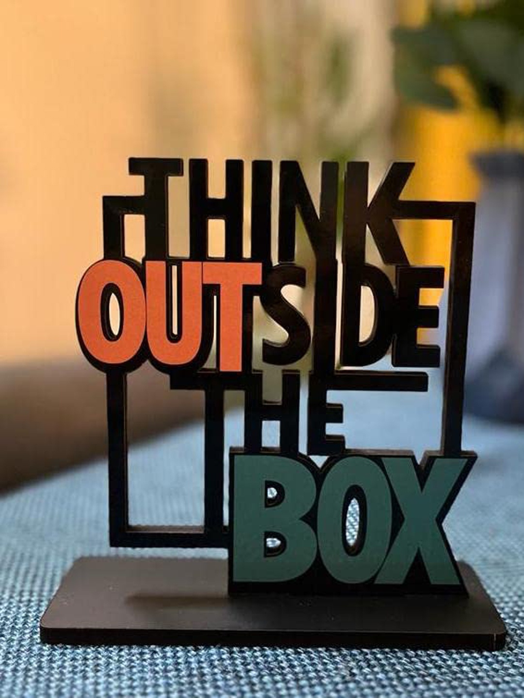

Kastner Black & Orange Think Out Side The Box Wood Figurine Showpiece