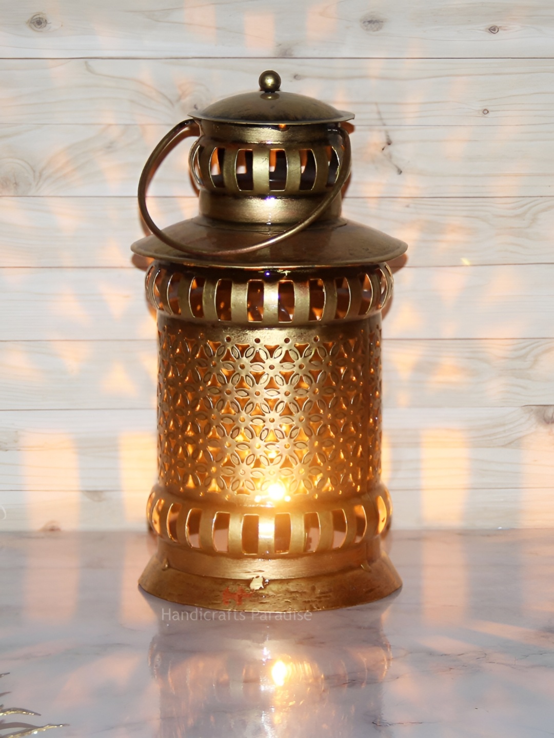 

HANDICRAFTS PARADISE Gold Toned Lantern Shaped Cut Work Tealight Holder Showpiece