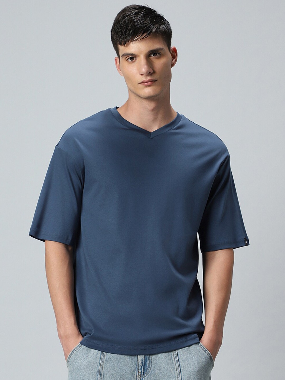 

Bewakoof V-Neck Drop-Shoulder Sleeves Oversized Cotton T-shirt, Blue