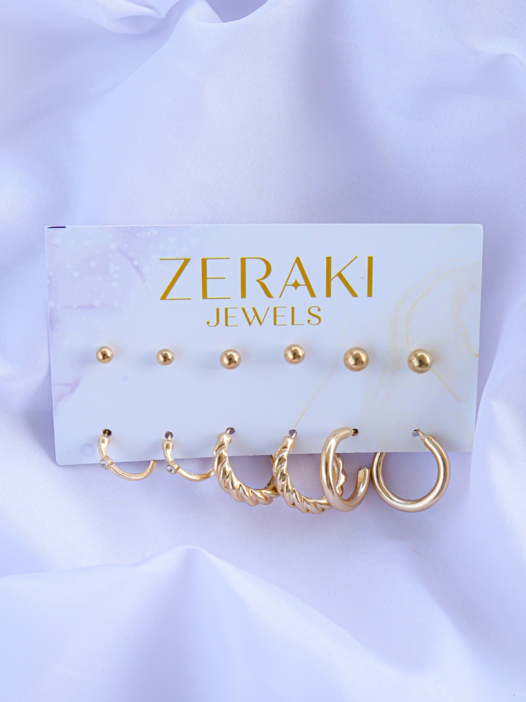 

Zeraki Jewels Set Of 9 Silver-Pleated Half Hoop & Studs Earrings, Gold