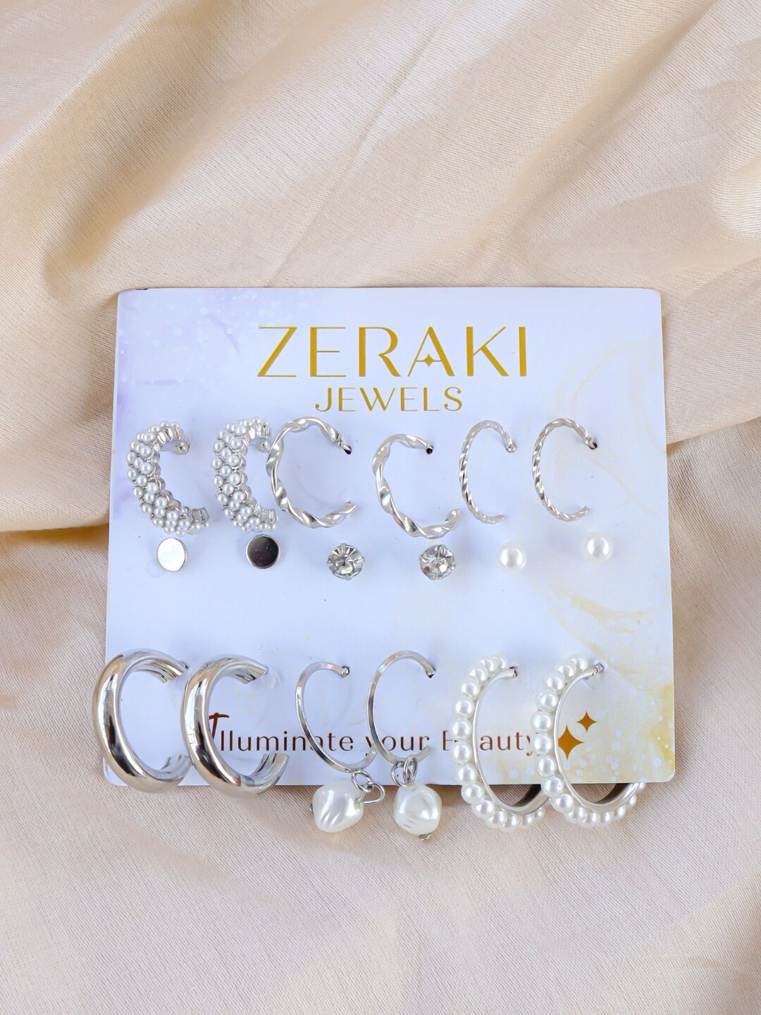 

Zeraki Jewels Set Of 9 Silver-Plated Cubic Zirconia Hoop Earrings