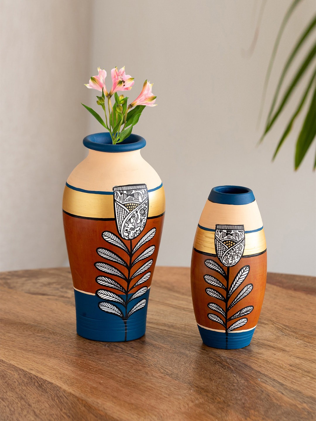 

ExclusiveLane Tulip Warli Tales Brown & Gold Toned 2 Pieces Printed Terracotta Vases