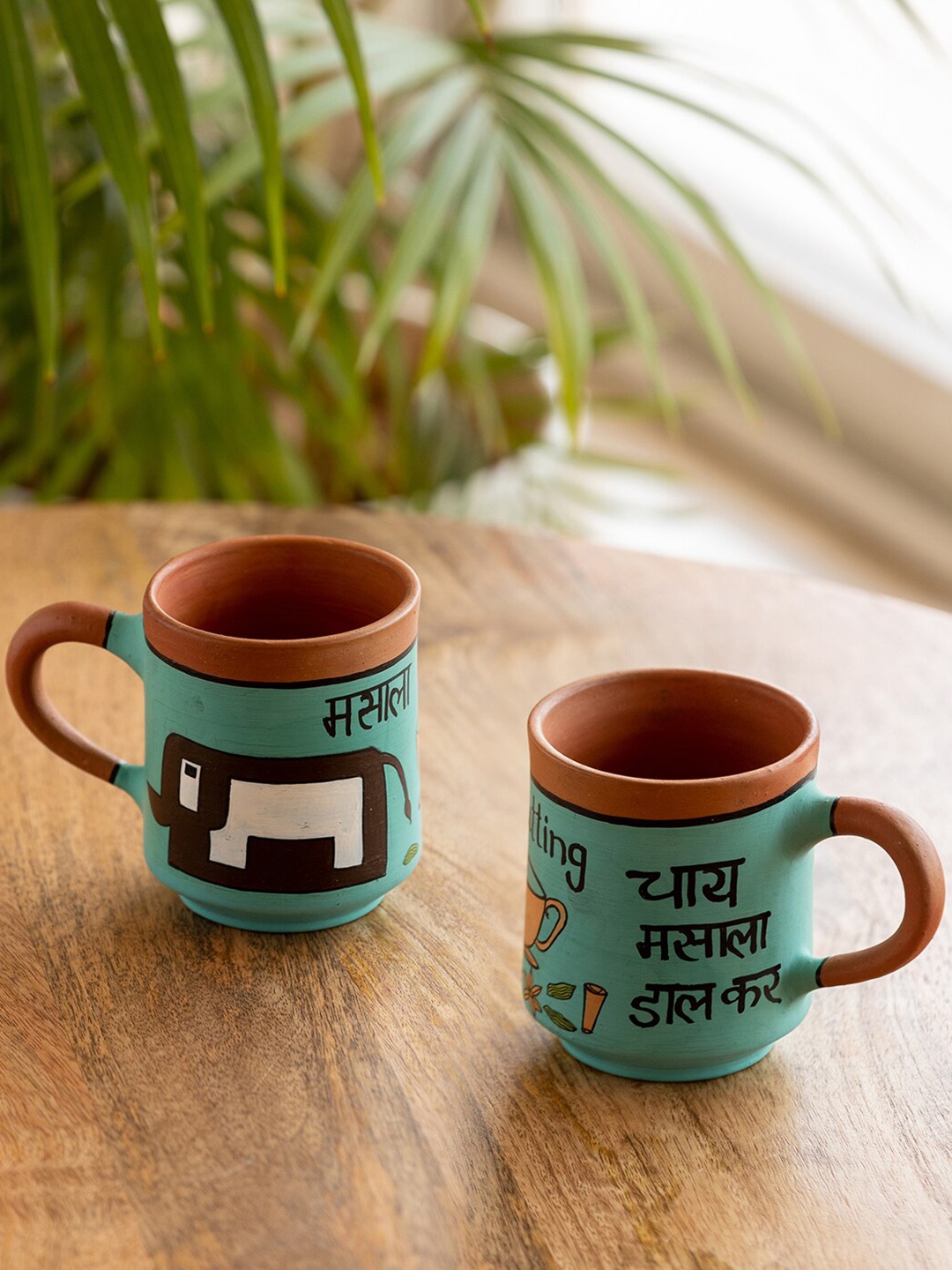 

ExclusiveLane Turquoise Blue 2 Pcs Chai Masala Printed Terracotta Matte Cups-210 ML Each