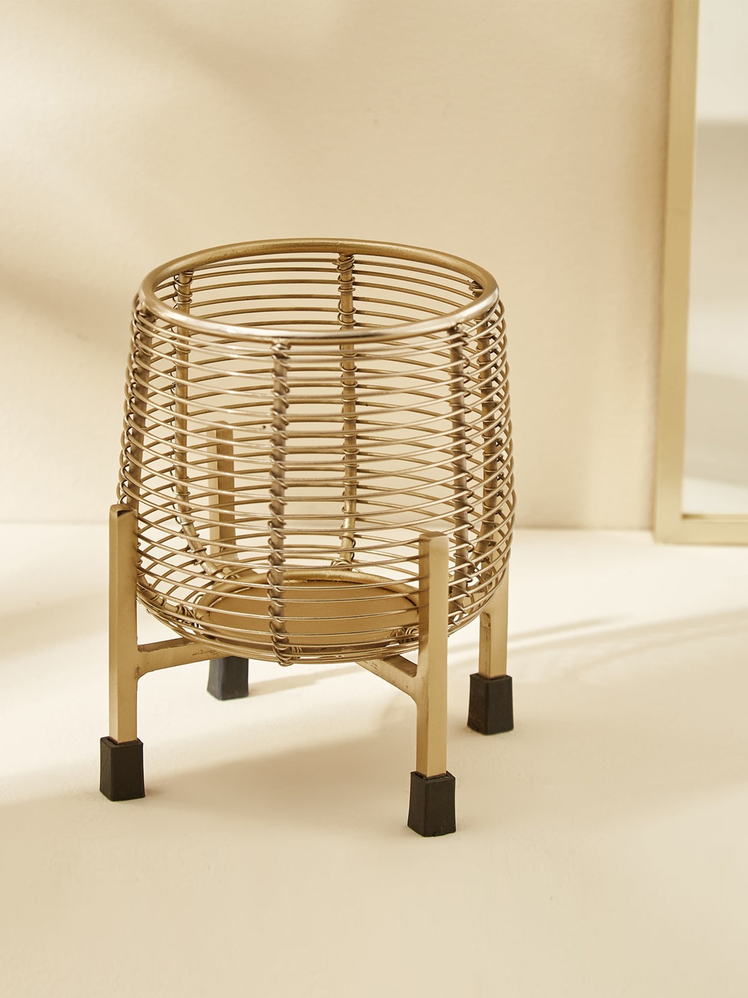 

Home Centre Splendid Megas Gold Toned Iron Wired Planter With Stand