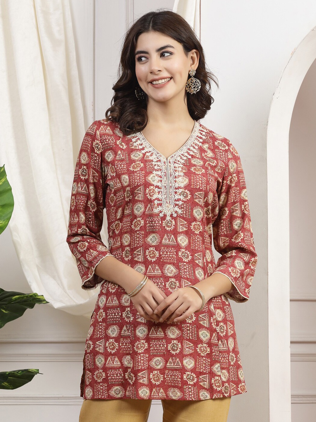 

Nayam By Lakshita Ethnic Motifs Printed V-Neck Thread Work Straight Kurti, Rust