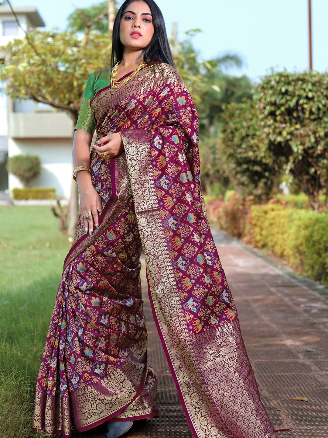 

Anouk Burgundy & Green Ethnic Motifs Woven Design Zari Pure Silk Patola Saree