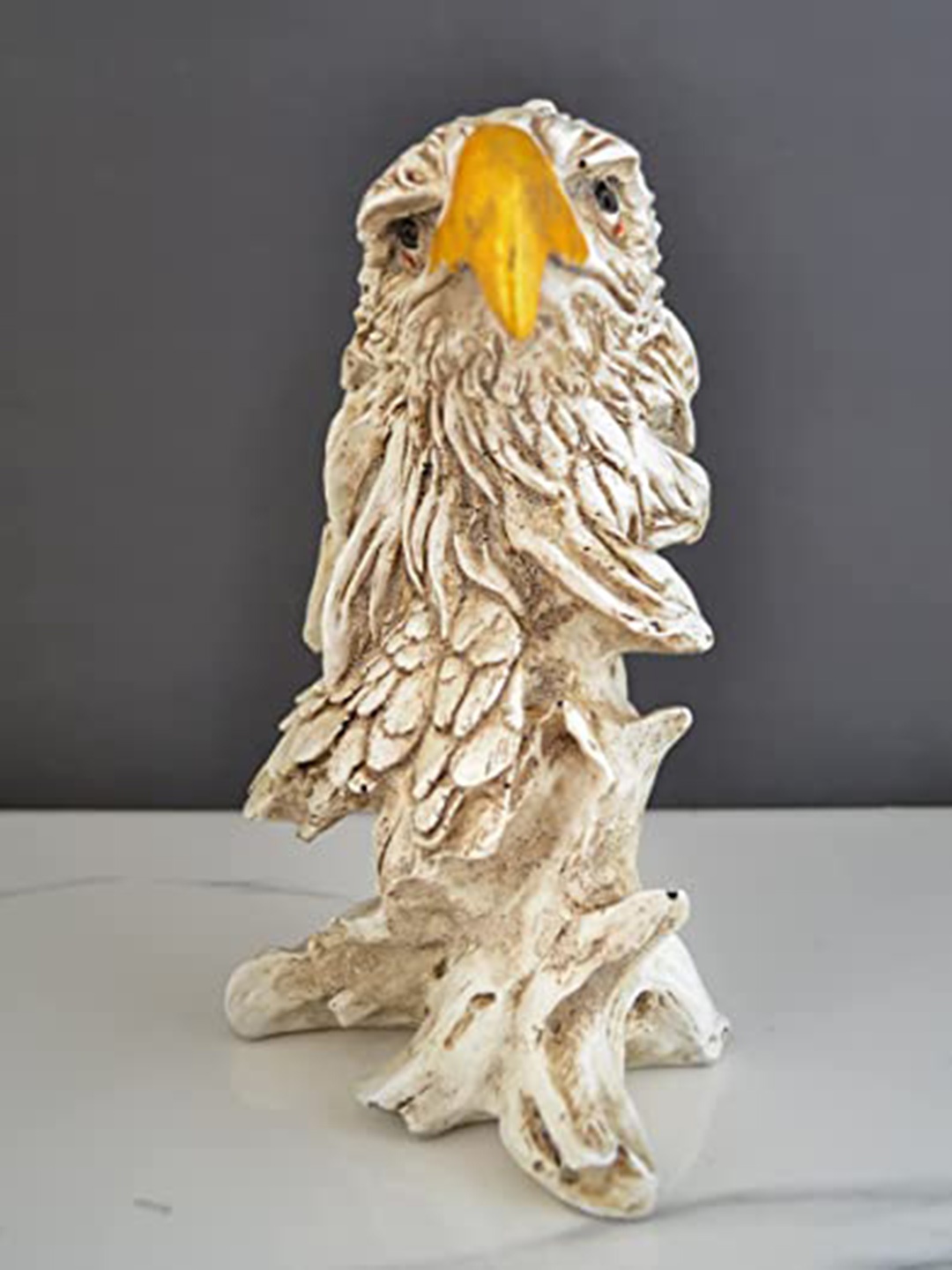 

ECLAT FURNISH Cream & Yellow Textured Eagle Head Polyresin Figurine Showpiece