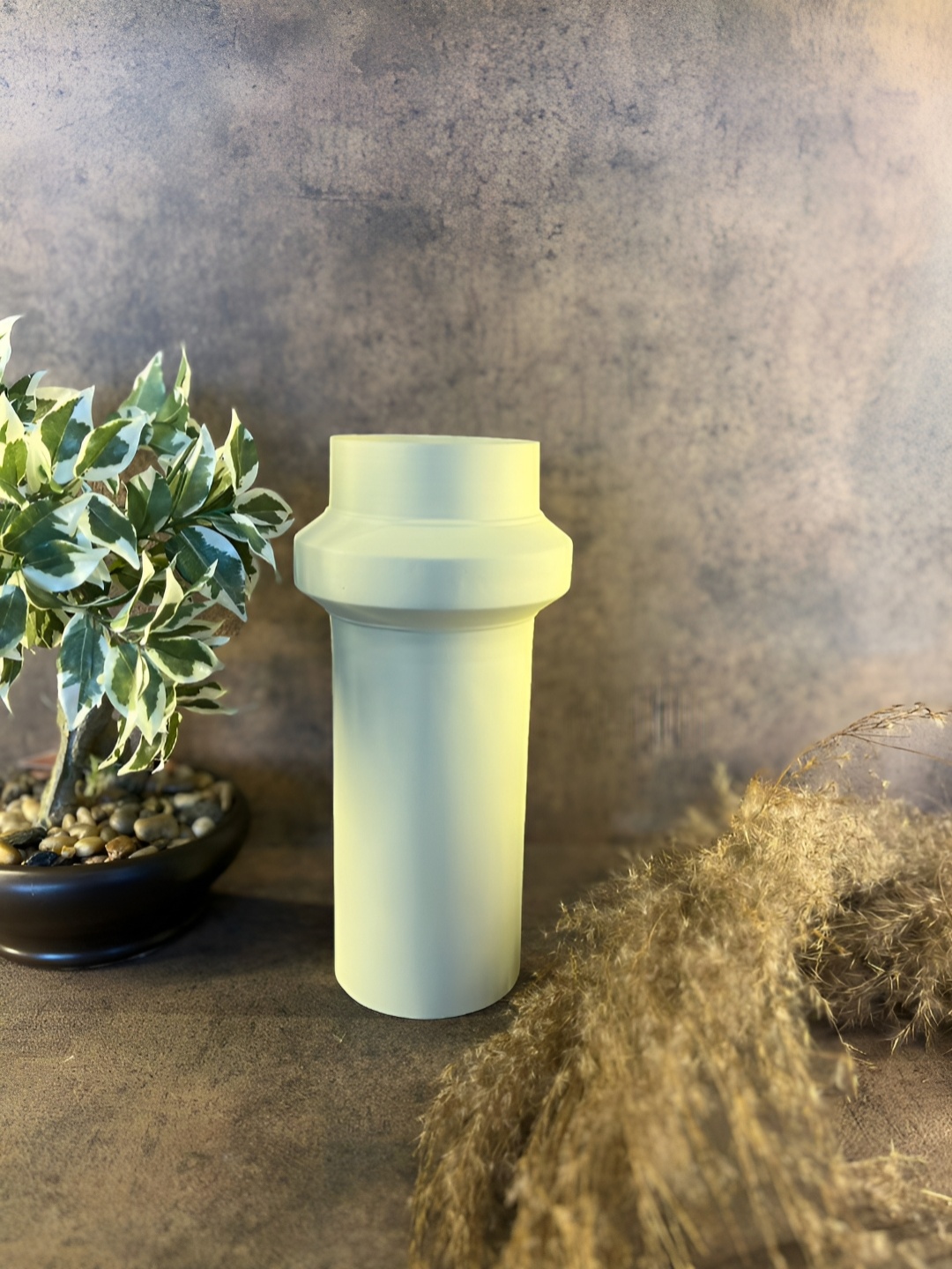 

The Artage Beige Metal Vase