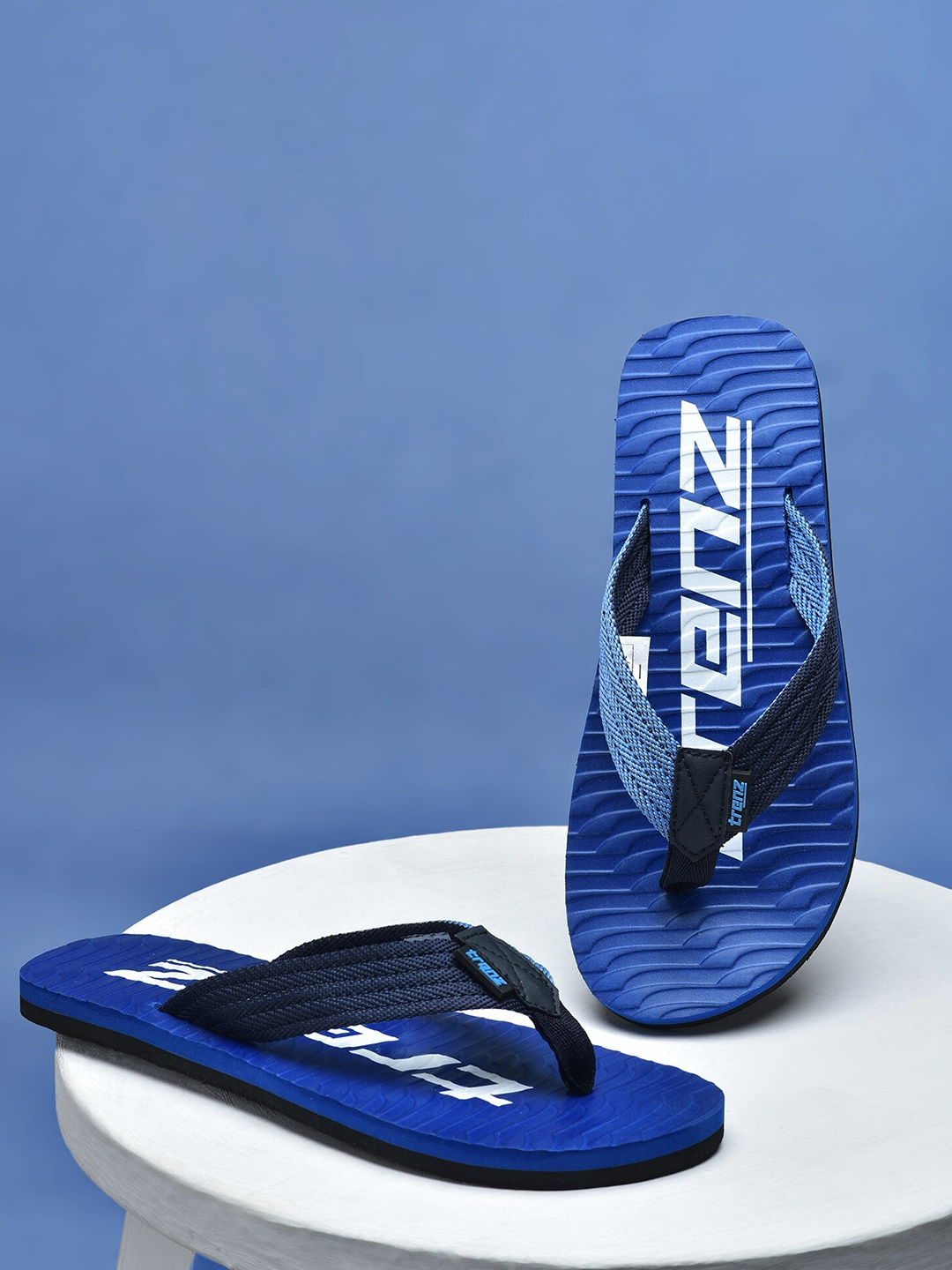 

Trenz Men Blue & White Printed Rubber Thong Flip-Flops