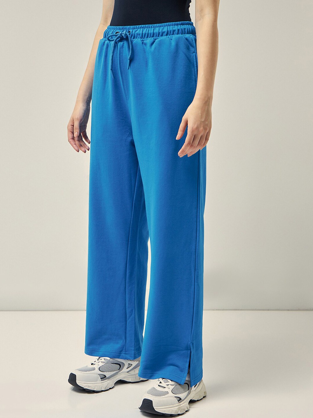 

Bewakoof AIR Women Mid-Rise Flared Trackpants, Blue