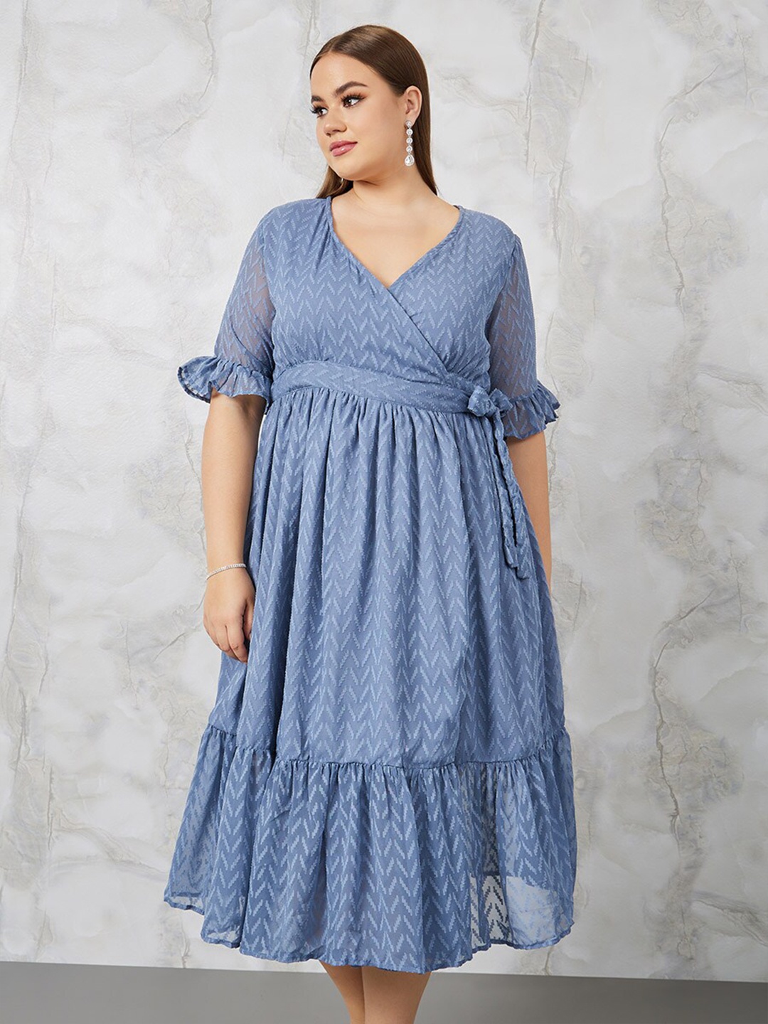 

Styli Plus Size Blue Self Design Bell Sleeves Belted Flounce Wrap Midi Dress, Navy blue