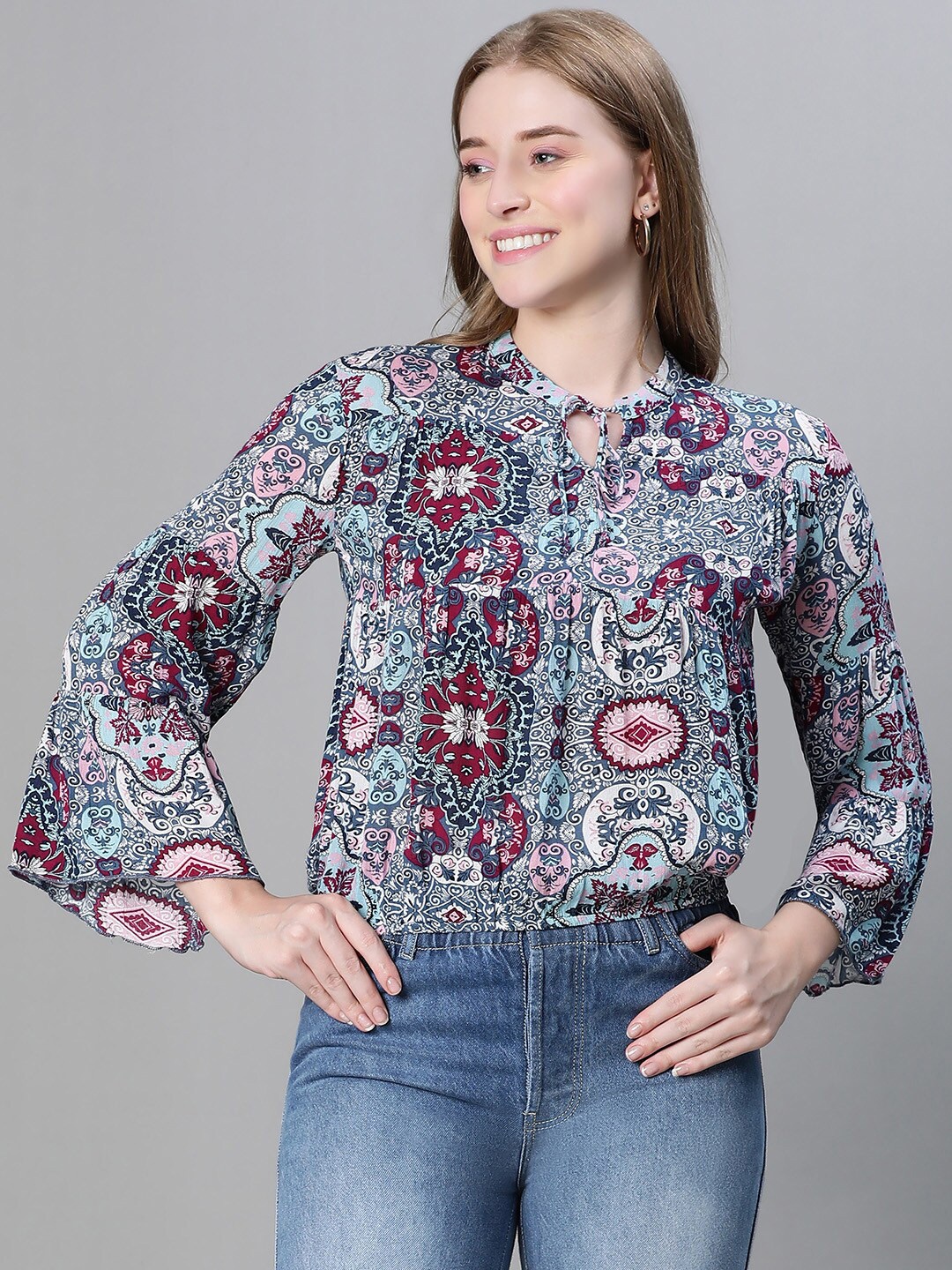 

Oxolloxo Ethnic Motifs Printed Tie-Up Neck Bell Sleeves Blouson Top, Blue