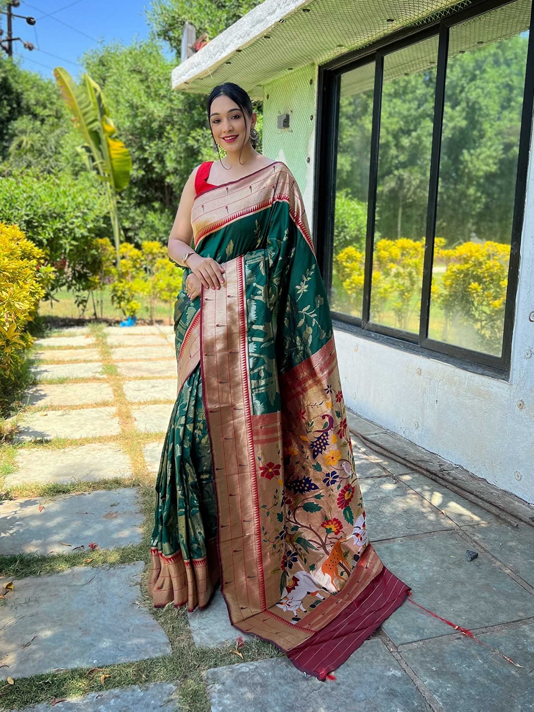 

Mitera Green Ethnic Motifs Woven Design Zari Paithani Saree