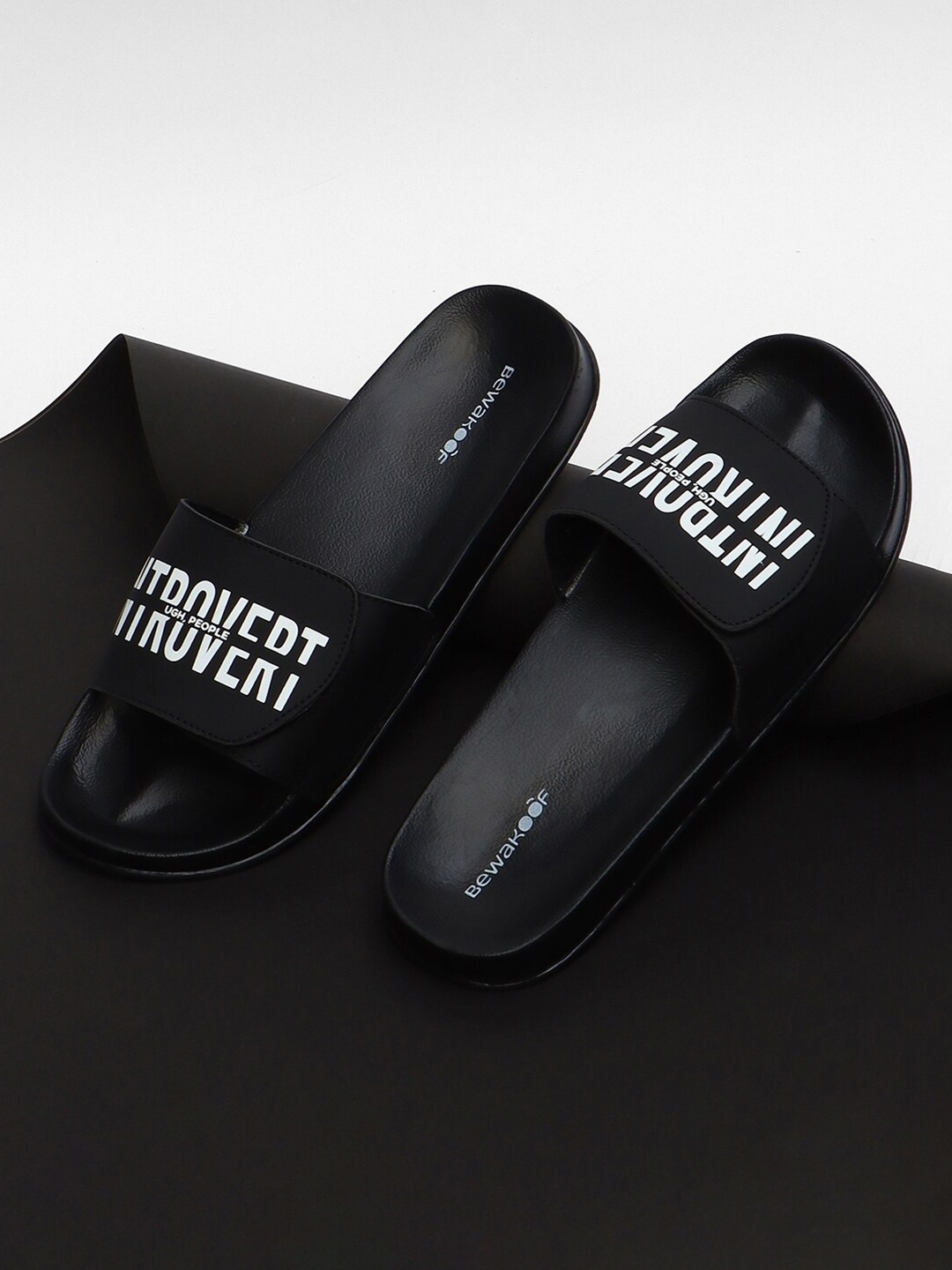 

Bewakoof Men Black & White Introvert Printed Sliders