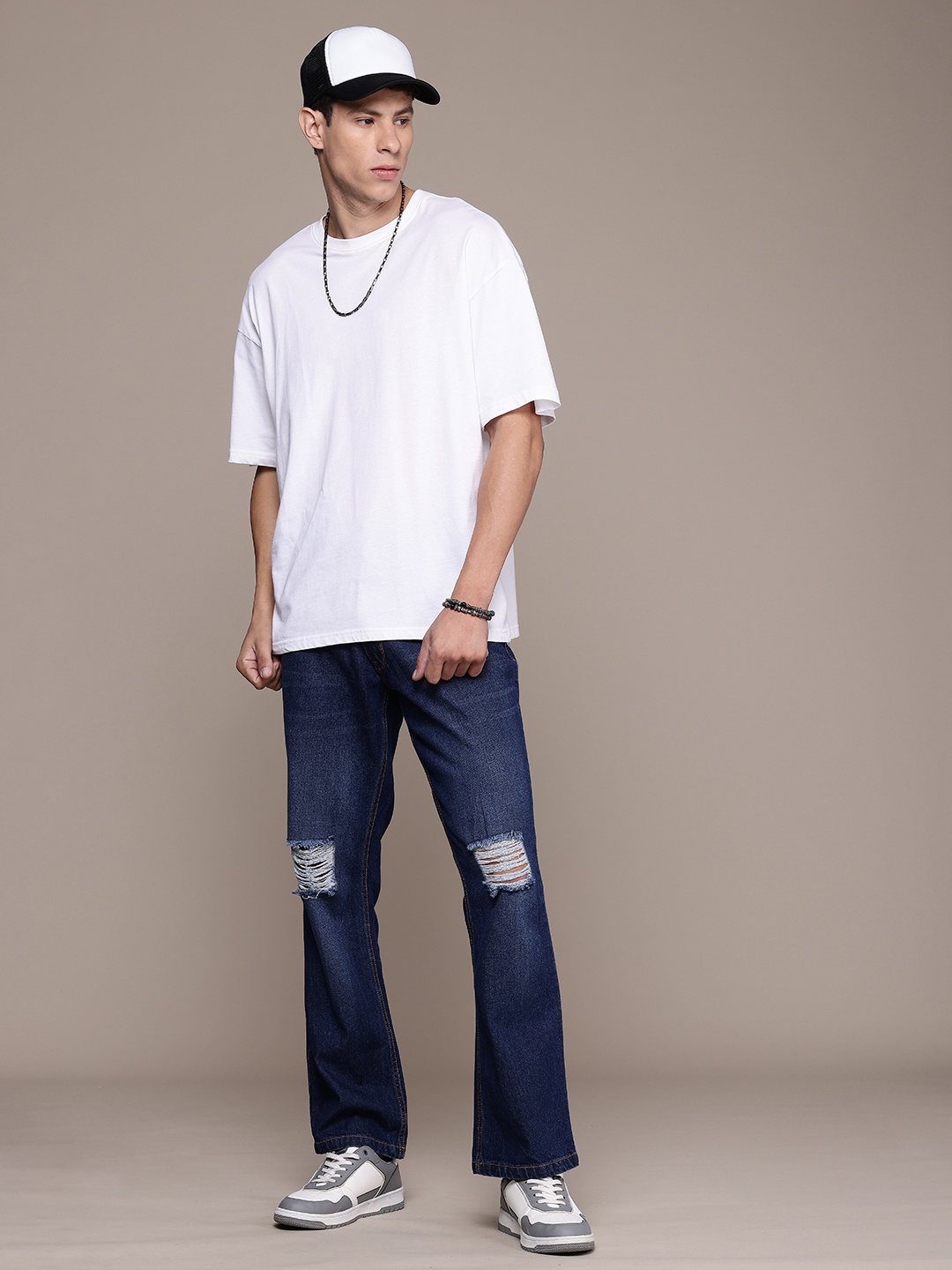 

The Roadster Life Co. Men Pure Cotton Bootcut Mildly Distressed Light Fade Jeans, Blue