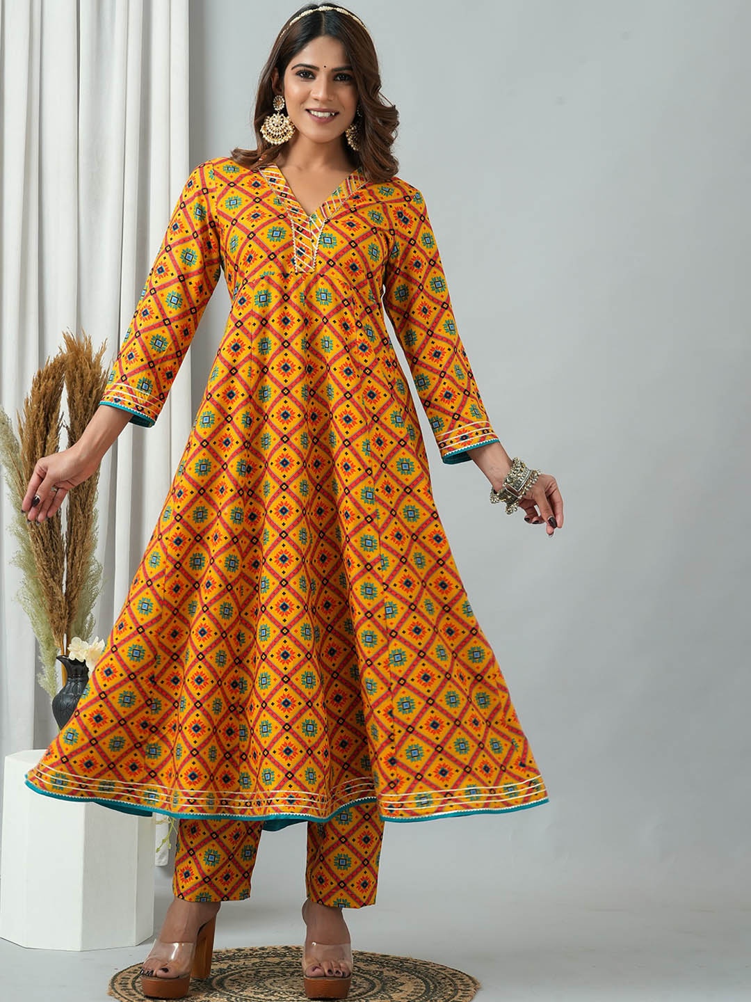

HERE&NOW Ethnic Motifs Printed V-Neck Anarkali Kurta With Trousers, Mustard