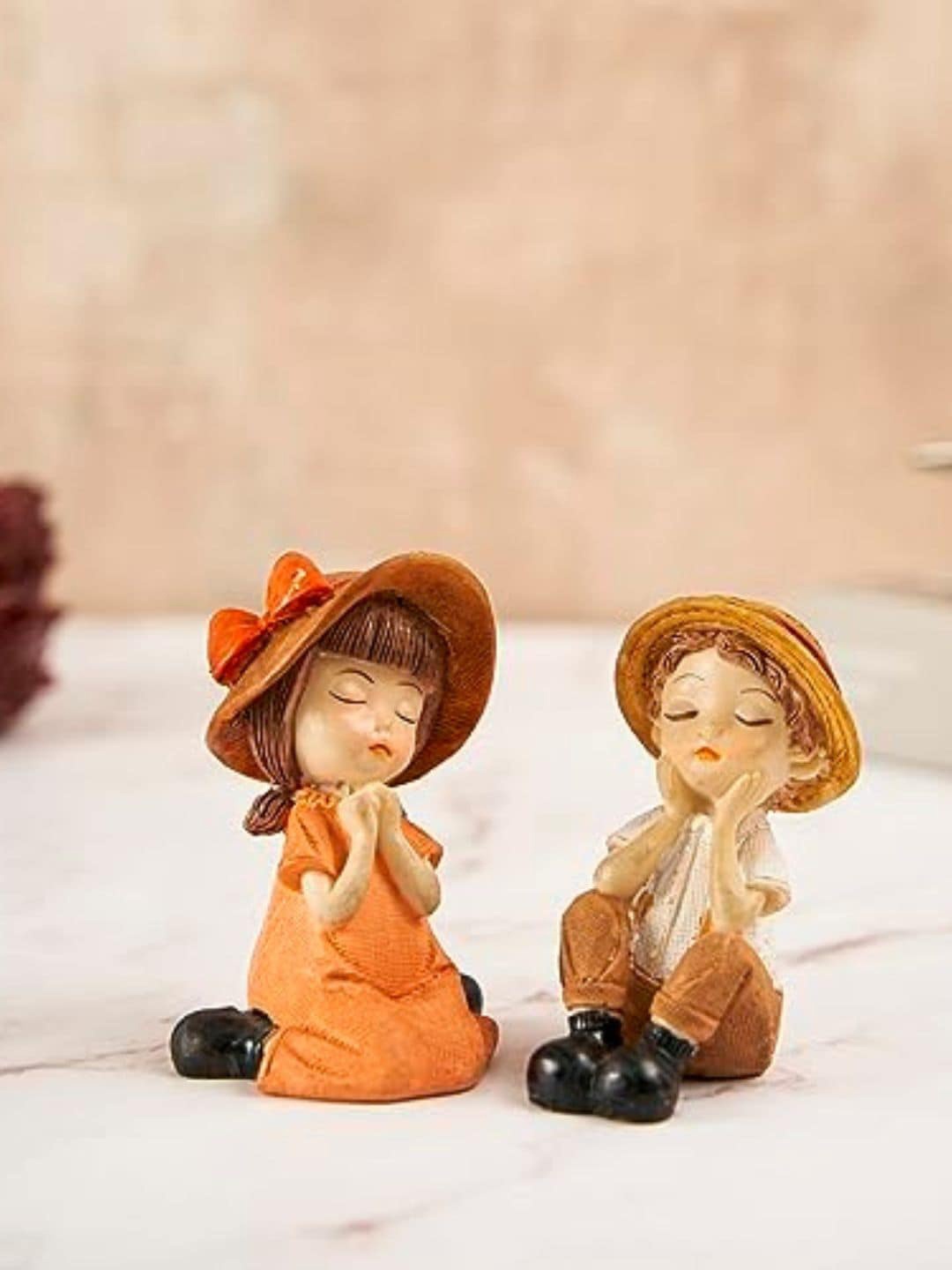 

DecorTwist Orange & Beige 2 Pieces Small Figurine Couple Showpiece