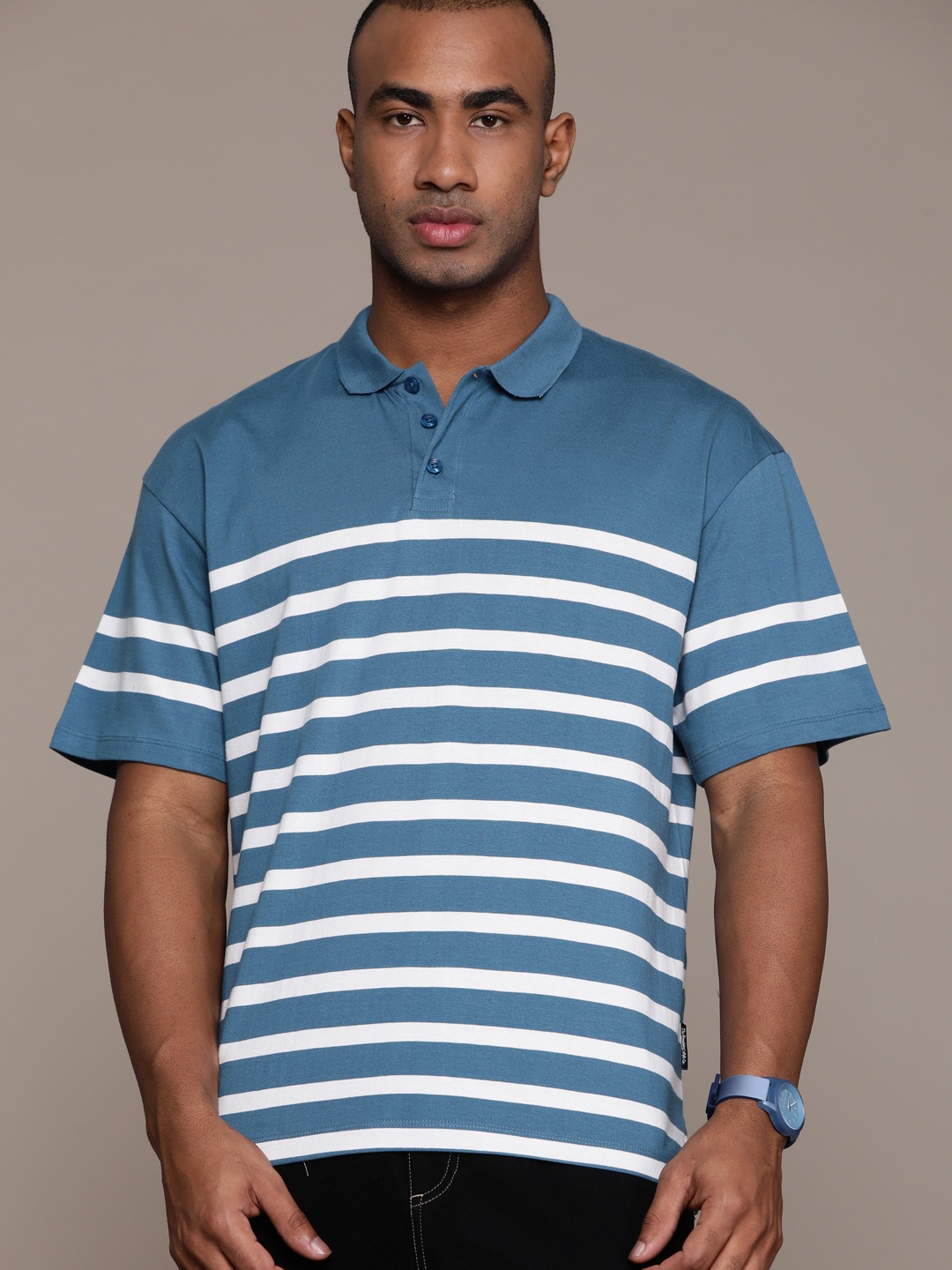 

The Roadster Lifestyle Co. Men Striped Polo Collar Pure Cotton T-shirt, Blue
