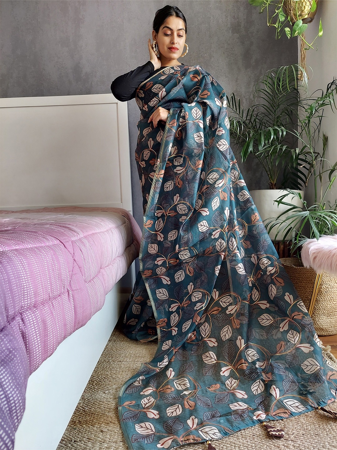 

Anouk Teal & Black Floral Printed Zari Saree