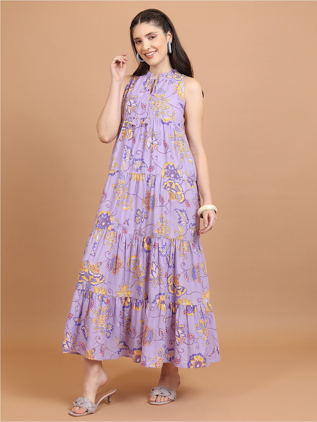 

Vishudh Lavender Floral Printed Sleeveless Tie-Up Neck Tiered Maxi Dress