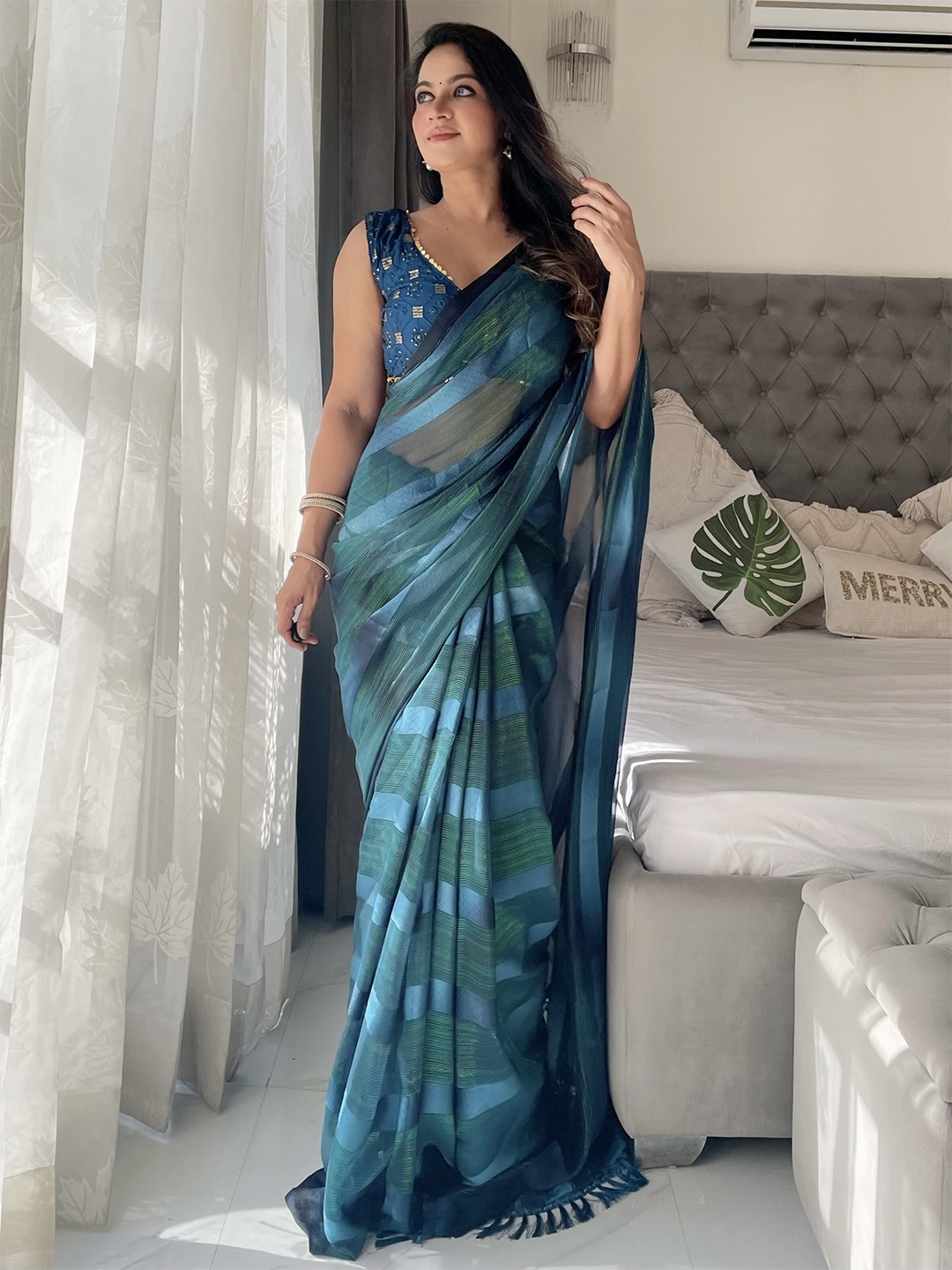 

Anouk Teal Striped Tasselled Border Saree