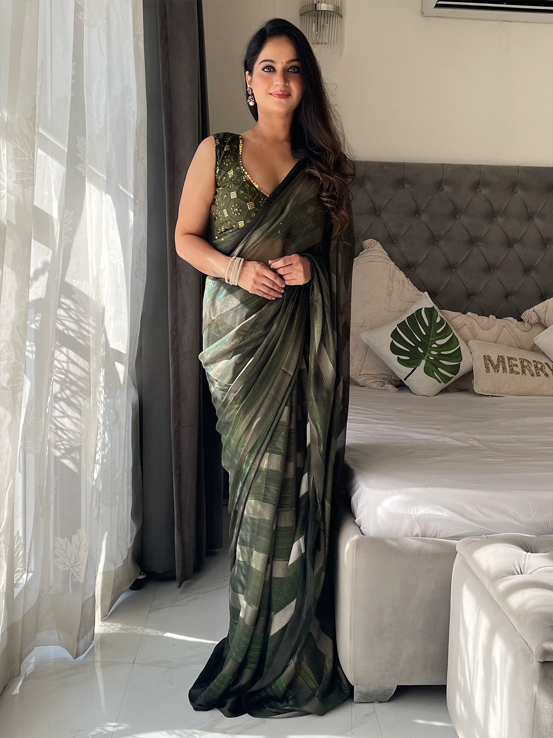

Anouk Green Striped Tasselled Border Saree