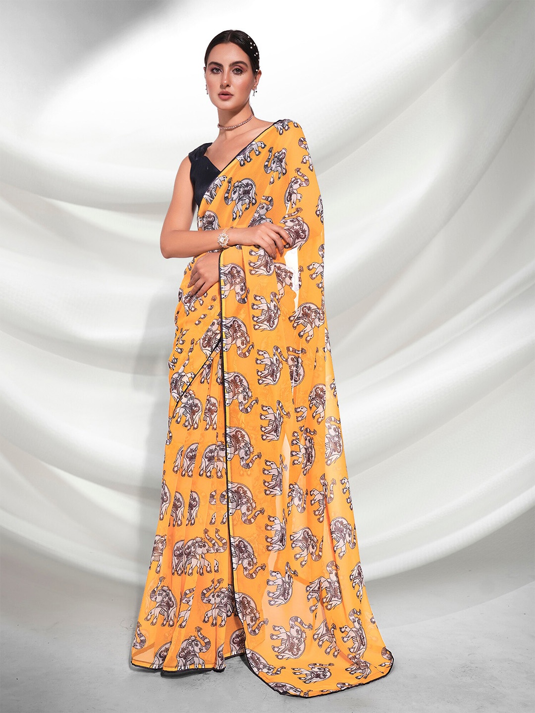 

Mitera Yellow Ethnic Motifs Printed Pure Georgette Saree