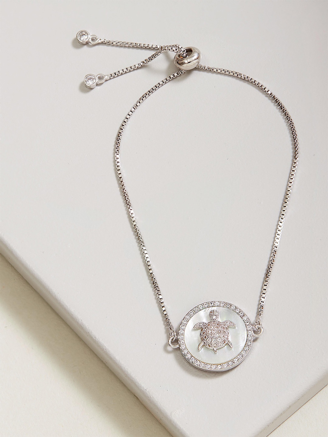 

Rhea Women Silver-Plated Cubic Zirconia Charm Bracelet
