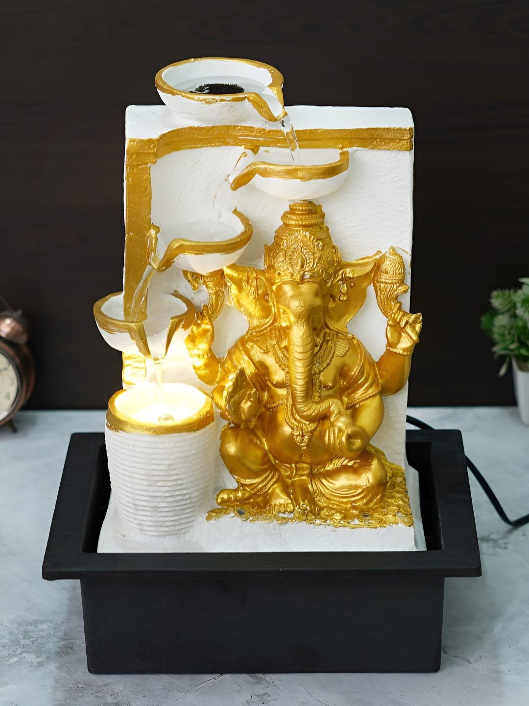 

Ancient Clock Makers White Power Operated Table Top Lord Ganesha Idol Water Fountain