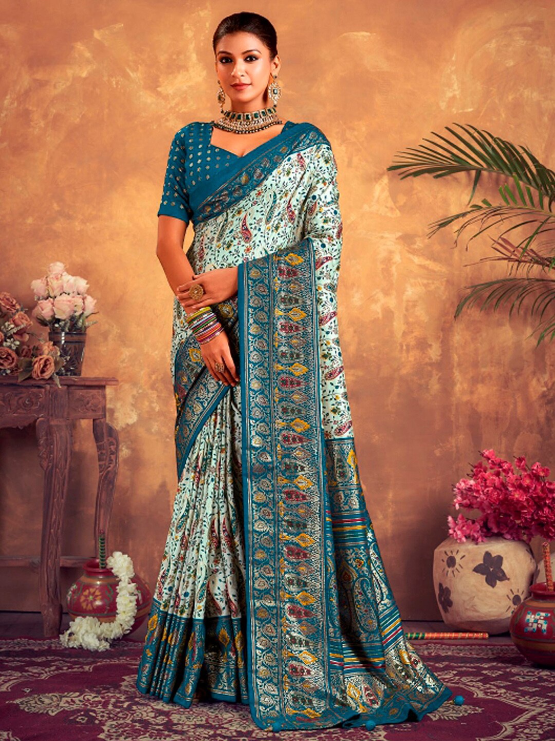

Mitera Turquoise Blue Floral Silk Blend Designer Banarasi Saree