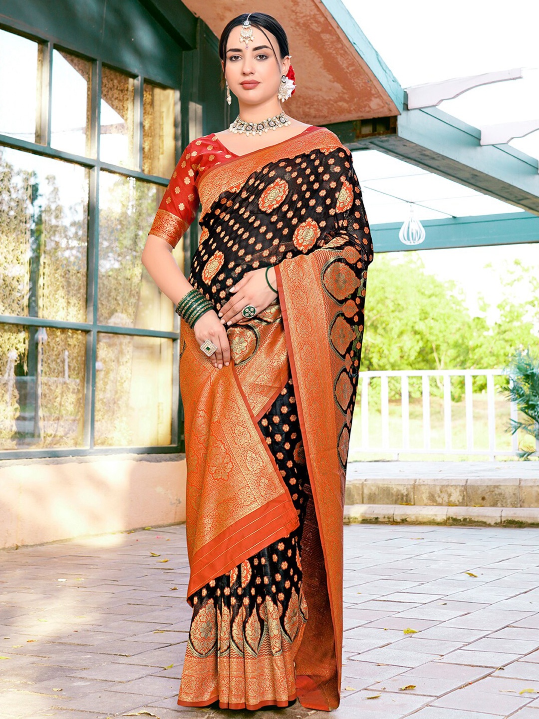 

Anouk Orange & Black Ethnic Motifs Woven Design Organza Saree