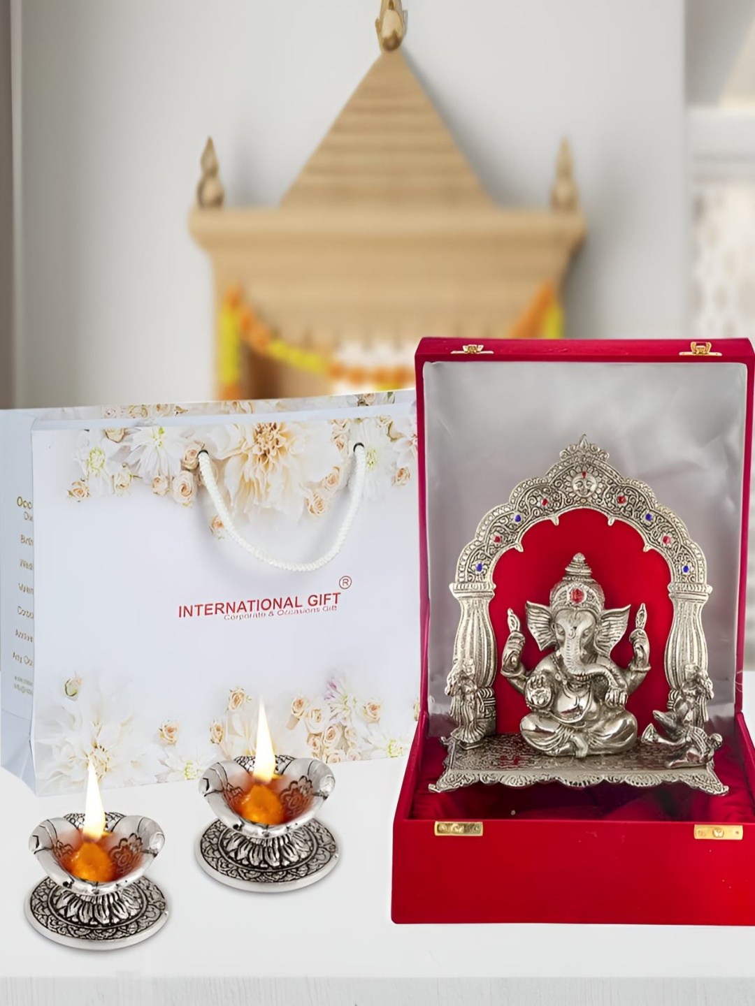 

INTERNATIONAL GIFT Ganesh Idol With Hand Diya With Beautiful Red Box, Silver