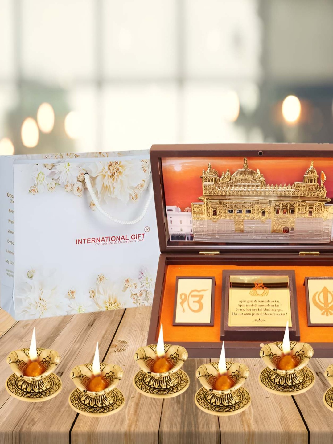 

INTERNATIONAL GIFT Gold Coated Temple God Idol & 6 Pieces Diyas Home Gift Set
