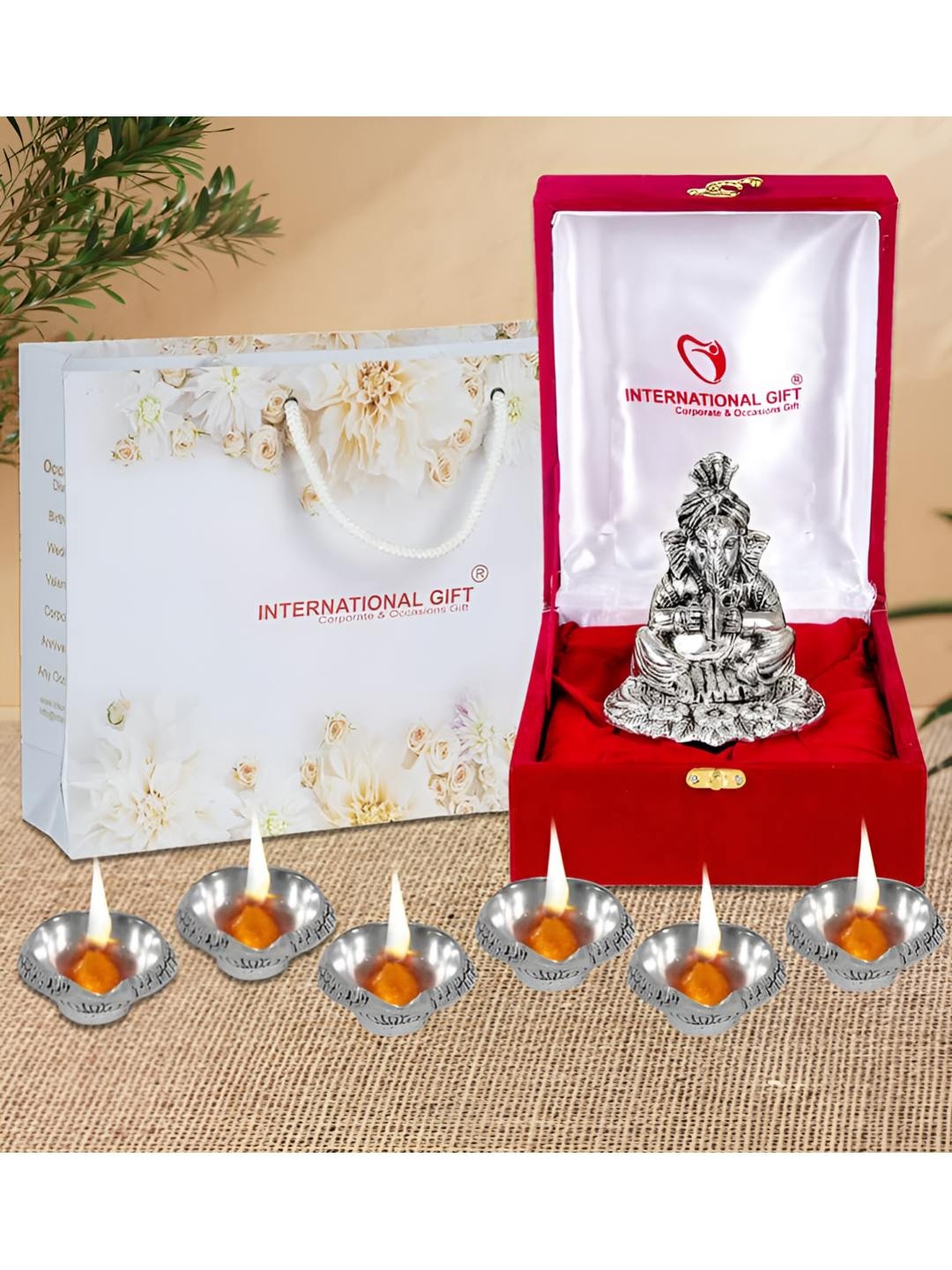 

INTERNATIONAL GIFT Silver Ganesh Idol & 6 Pieces Diyas Home Gift Set