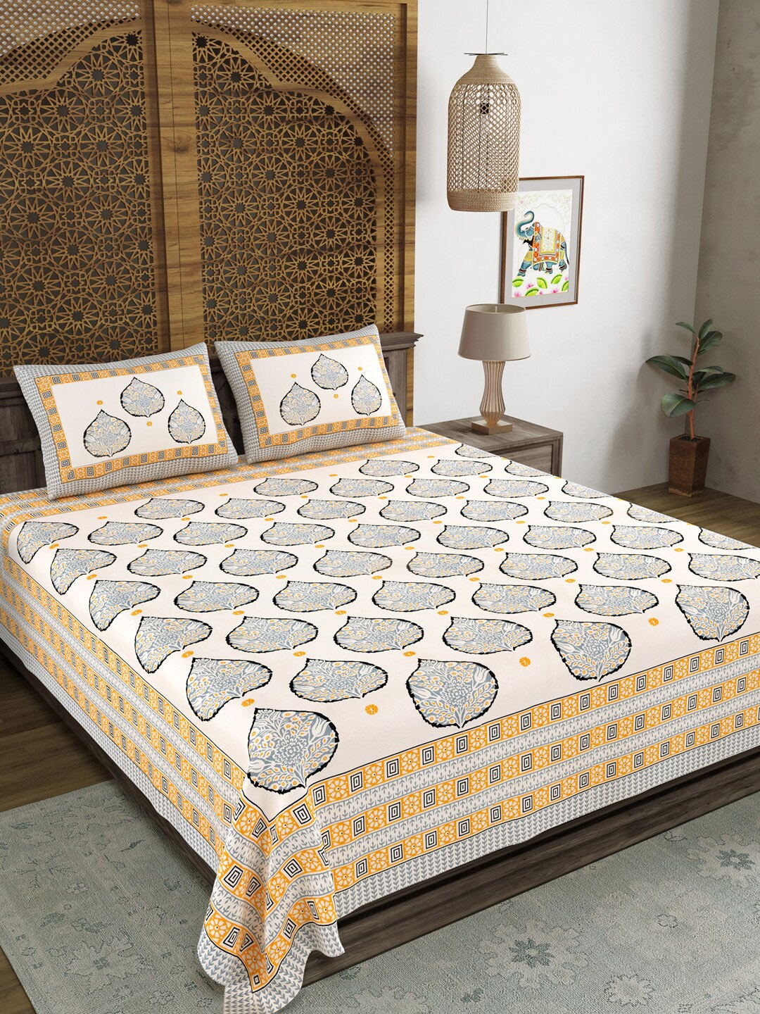 

Aura Yellow & Grey Ethnic Motifs Printed 120 TC Queen Bedsheet with 2 Pillow Covers