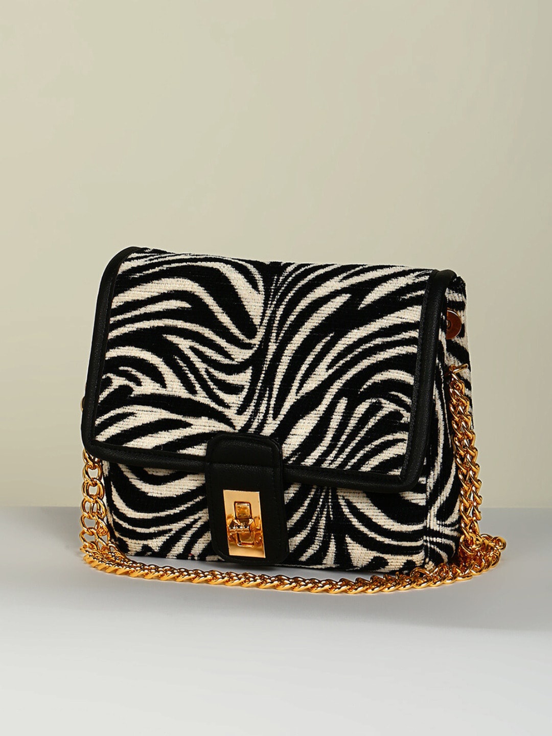 

DEEBACO Animal Printed Structured Fabric Sling Bag, Black